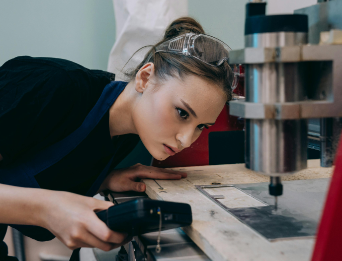 A student works on a machine; she is one of the future EKCEP success stories