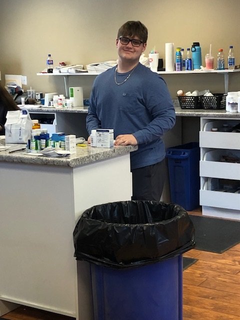 a person standing behind a counter