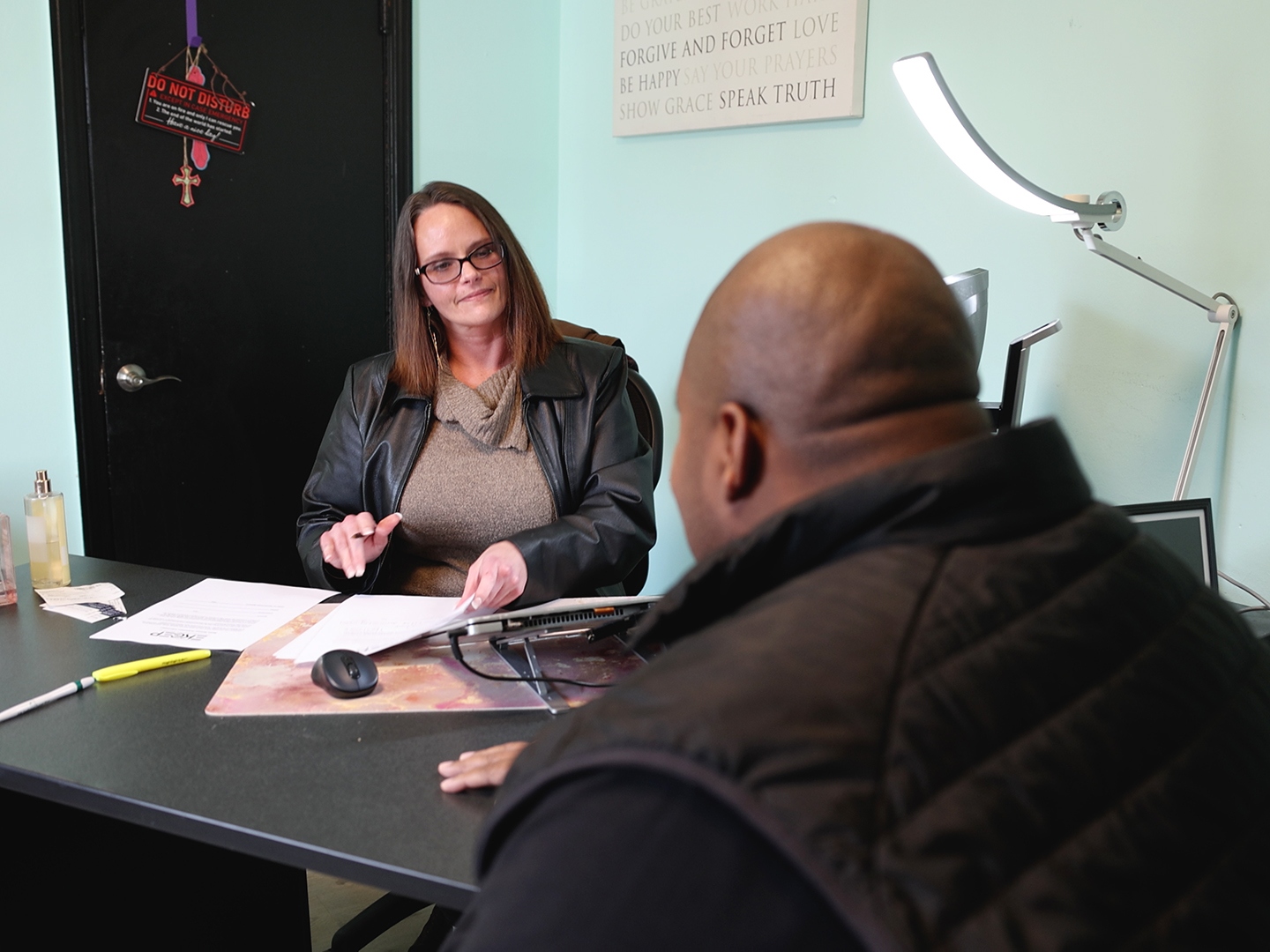 An EKCEP career advisor meeting with a client in her office.